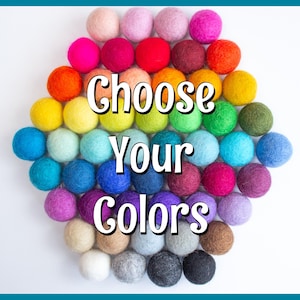 May include: A variety of colorful felt balls arranged in a circle. The text "Choose Your Colors" is in the center of the circle.