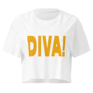 May include: A white short-sleeved crop top featuring the word DIVA! printed in bold, mustard yellow capital letters across the center of the chest. The garment has a round neckline and a straight, cropped hemline that sits above the waist.