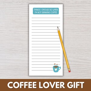May include: A white notepad with horizontal lines and the text "THINGS I SHOULD DO WHEN I'M NOT DRINKING COFFEE" in a blue rectangle. A yellow pencil rests on the notepad. A blue coffee cup with hearts is at the bottom.
