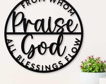 May include: Black metal wall decor with the text "From Whom All Blessings Flow Praise God" in a circle.