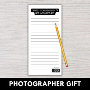 May include: A white notepad with horizontal lines and the text "THINGS I SHOULD DO WHEN I'M NOT TAKING PICTURES" at the top. A yellow pencil rests on the notepad. A small camera graphic is at the bottom.
