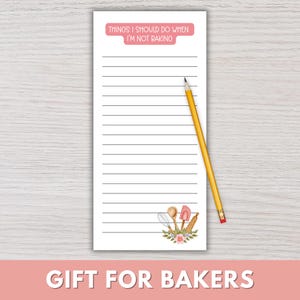 May include: A white notepad with horizontal lines and the text "THINGS I SHOULD DO WHEN I'M NOT BAKING" in a pink banner. A yellow pencil rests on the notepad. The bottom features a floral design with baking tools. The text "GIFT FOR BAKERS" is at the bottom.