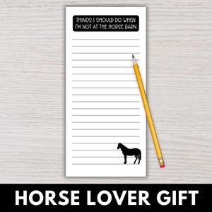 May include: A white notepad with horizontal lines, a black horse silhouette, and the text "THINGS I SHOULD DO WHEN I'M NOT AT THE HORSE BARN." A yellow pencil rests on the notepad. The bottom of the notepad reads "HORSE LOVER GIFT."