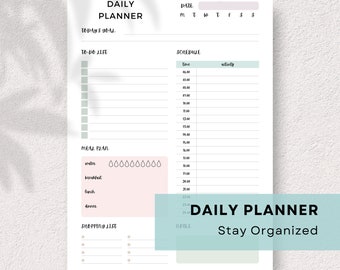 May include: A printable daily planner with sections for today's goal, to-do list, schedule, meal plan, shopping list, and notes. The planner has a light green and pink color scheme.