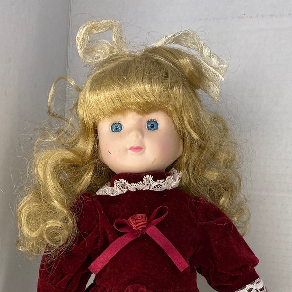 Porcelain doll red velvet dress