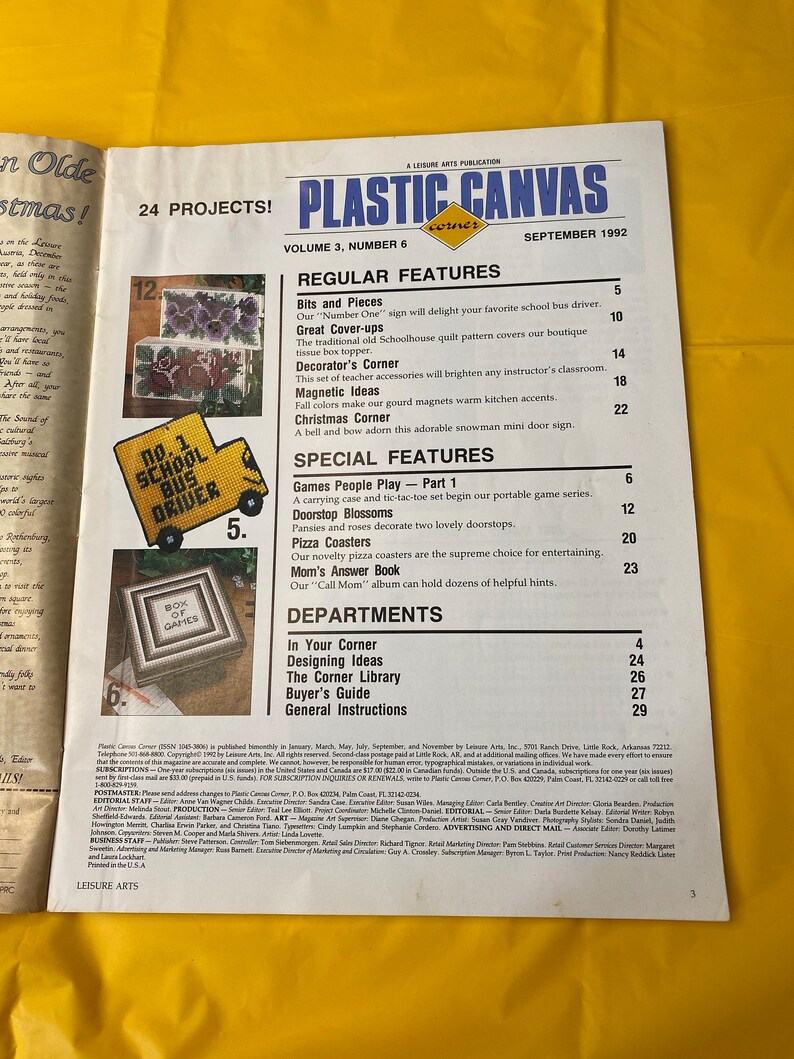 May include: A magazine cover for Plastic Canvas Corner, Volume 3, Number 6, September 1992. The cover features a colorful illustration of a school bus driver with the text "No. 1 School Bus Driver". The magazine features 24 projects and includes regular features such as "Bits and Pieces", "Great Cover-ups", "Decorator's Corner", "Magnetic Ideas", and "Christmas Corner".