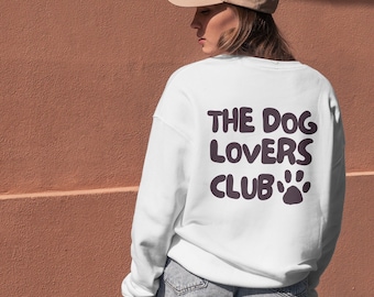 May include: White sweatshirt with the text "THE DOG LOVERS CLUB" and a paw print in black.