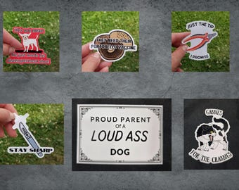 May include: A set of nine stickers with various designs and text. The stickers include a dog with text that says "He's not mean, he just needs his distemperment shot!" and "They need their portobello vaccine", a pair of pliers with text that says "Just the tip, I promise", a scalpel with text that says "Stay sharp", a sign that says "Proud parent of a loud ass dog", and a cat with text that says "Gabbie's for the crabbies".