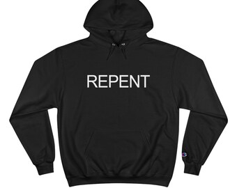 May include: Black hooded sweatshirt with a white "REPENT" graphic on the front. The sweatshirt has a Champion logo on the left sleeve.