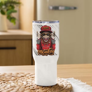 May include: White stainless steel tumbler featuring a graphic of a monkey wearing a red hoodie, sunglasses, and a gold chain. The monkey is making a peace sign with both hands. The text "Monkey Funky" is printed below the monkey.