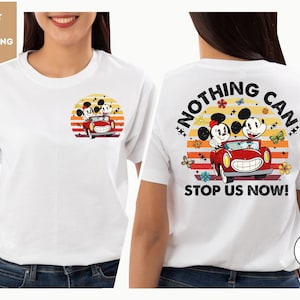 a woman wearing a white t - shirt with mickey mouse on it