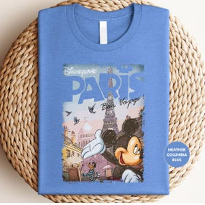a blue shirt with a picture of mickey mouse on it