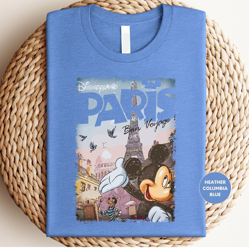 a blue shirt with a picture of mickey mouse on it