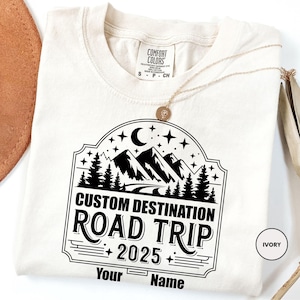 a white t - shirt with the words custom destination road trip on it
