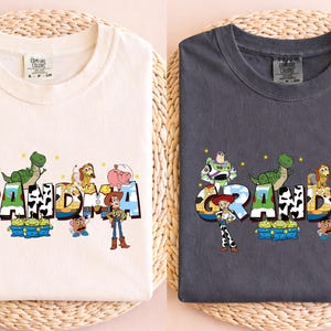 a couple of t - shirts hanging on a wall