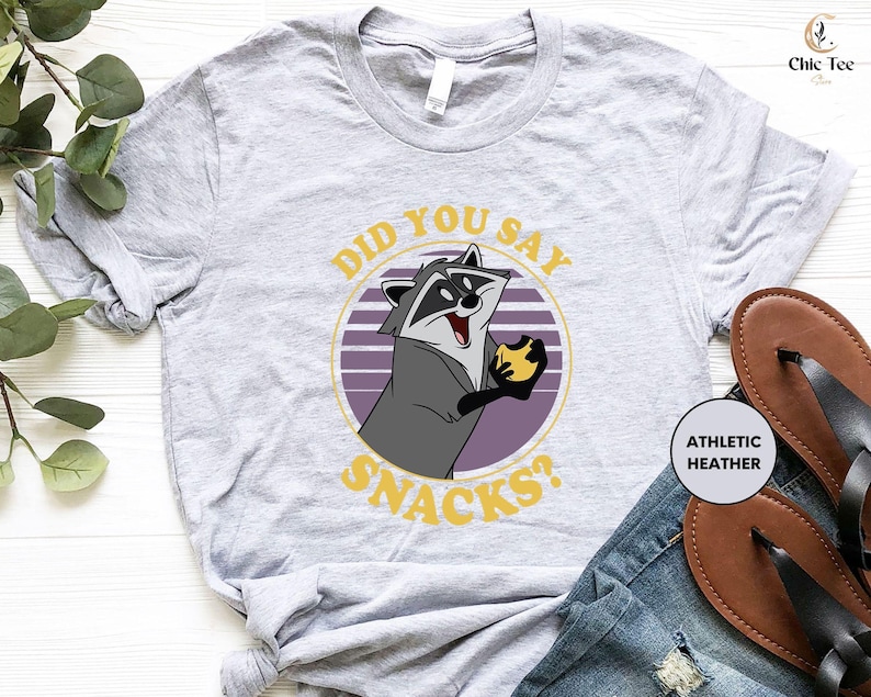 a shirt with a raccoon saying did you say snacks?