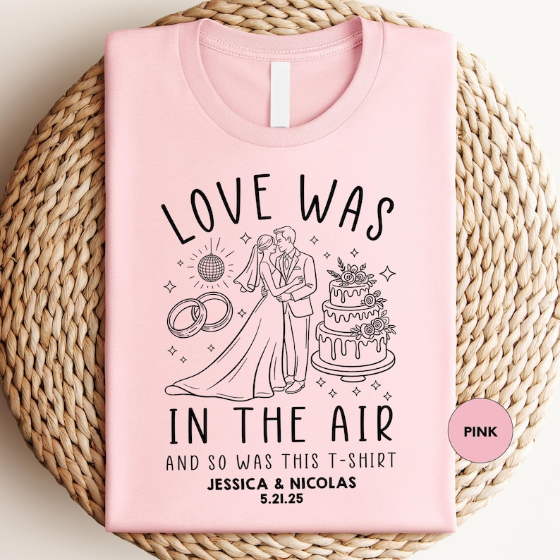 a pink t - shirt with a picture of a bride and groom