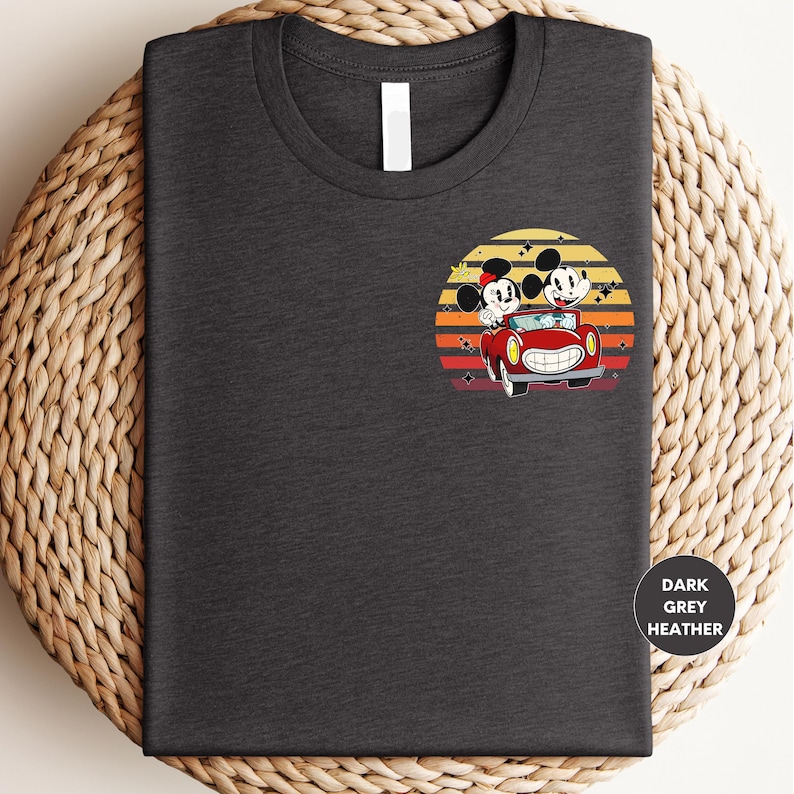 a t - shirt with mickey and minnie driving a car