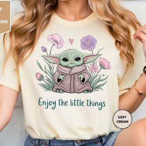 a woman wearing a t - shirt that says, enjoy the little things