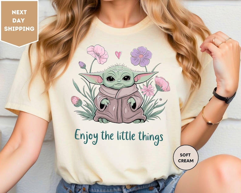 a woman wearing a t - shirt that says, enjoy the little things