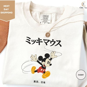 a white tshirt with a mickey mouse on it