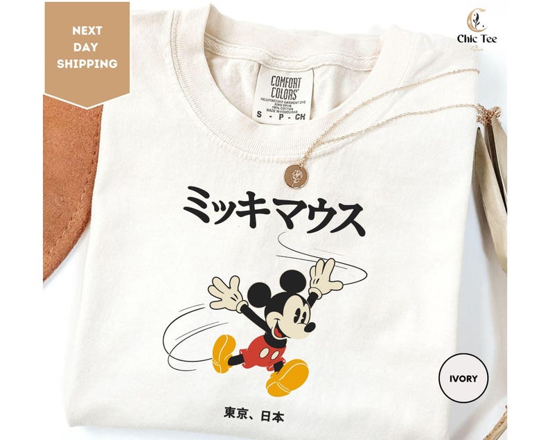 a white tshirt with a mickey mouse on it