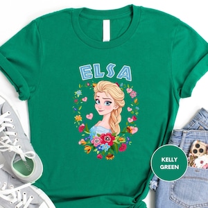 a green tshirt with a picture of a blonde girl with flowers on it