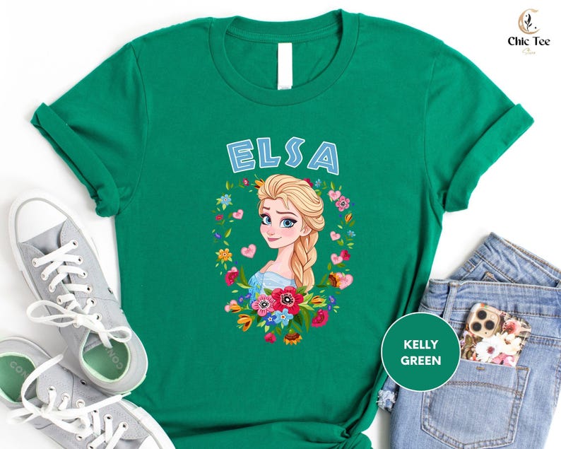 a green tshirt with a picture of a blonde girl with flowers on it