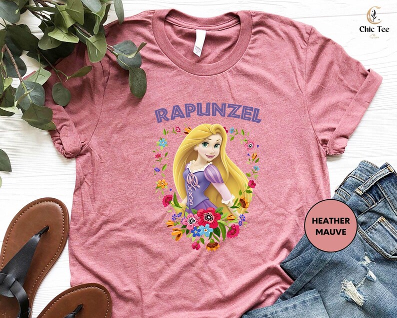 a pink shirt with a picture of rapunzel on it