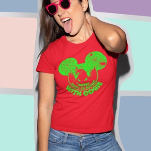 May include: Red t-shirt with a green Mickey Mouse head graphic. The graphic features a spider web, a pumpkin, and the text "Ready to Boogie with Oogie".