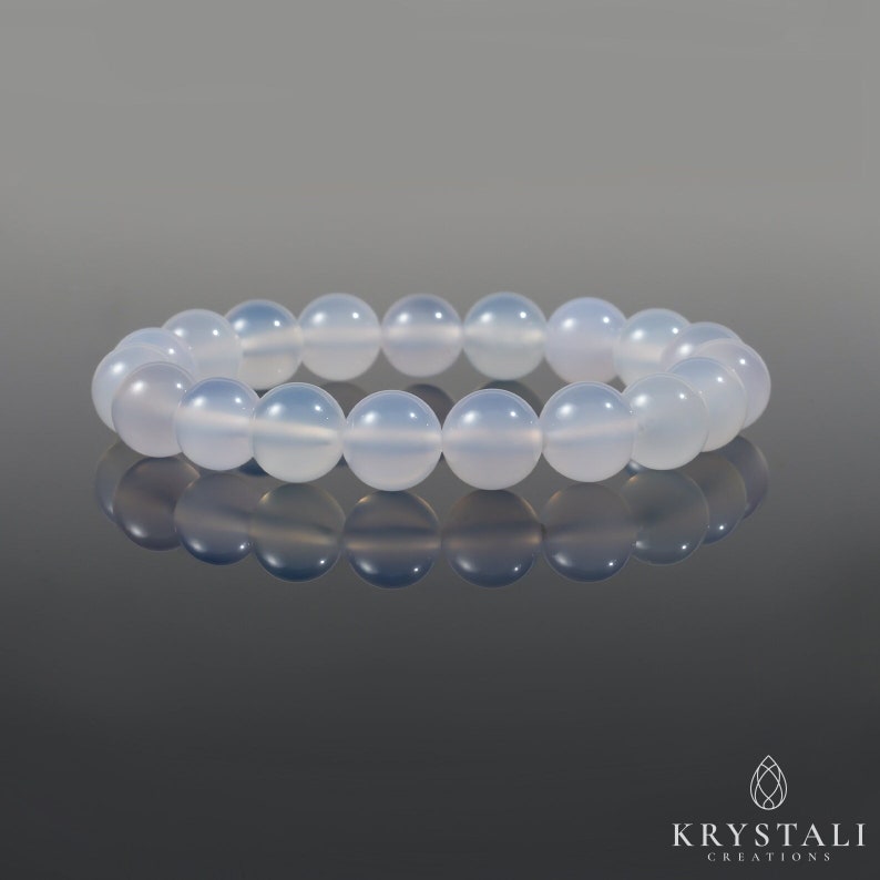 May include: A bracelet made of light blue chalcedony beads. The bracelet is made of 18 beads and is approximately 7 inches in length.