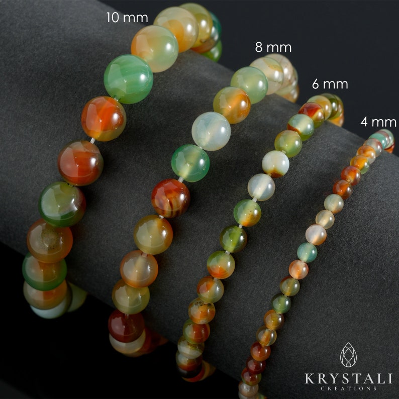 K&ouml;nnte beinhalten: Vier Armband aus Achat-Edelsteinen in verschiedenen Gr&ouml;&szlig;en, 4 mm, 6 mm, 8 mm und 10 mm. Die Armb&auml;nder bestehen aus nat&uuml;rlichen Achat-Steinen in einer Mischung aus Gr&uuml;n-, Orange- und Braunt&ouml;nen.