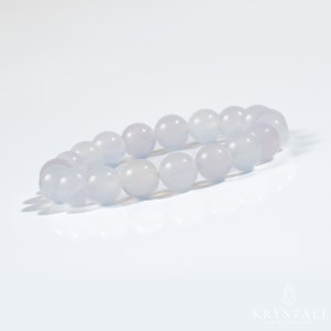 May include: A light blue gemstone bracelet with round beads. The bracelet is made of natural stones and is perfect for everyday wear.