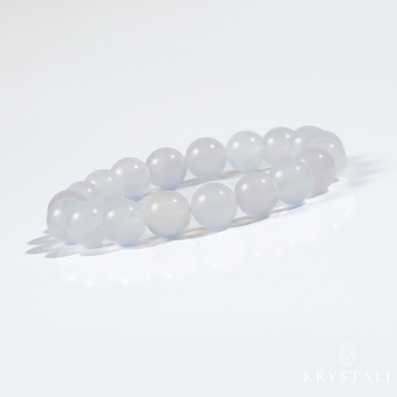 May include: A light blue gemstone bracelet with round beads. The bracelet is made of natural stones and is perfect for everyday wear.
