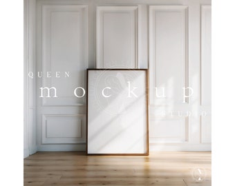 May include: A gold framed poster mockup in a white room with white wainscoting. The poster is blank and ready for your design.