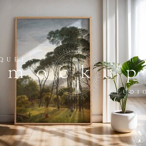 May include: A framed painting of a forest scene with tall trees and a group of people in the distance. The painting is in a wooden frame and is hanging on a white wall.