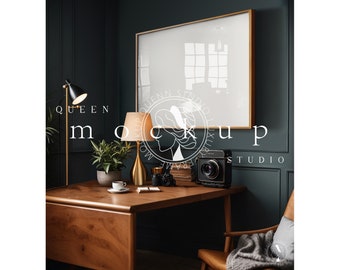 May include: A dark green room with a wooden desk and a gold framed picture hanging on the wall. There are two lamps on the desk, one with a black shade and one with a cream shade. There is a potted plant on the desk, a cup of coffee, and a book. There is a vintage camera on the desk and a chair with a blanket on it in the corner of the room. The text "QUEEN MOCKUP STUDIO" is visible in the image.