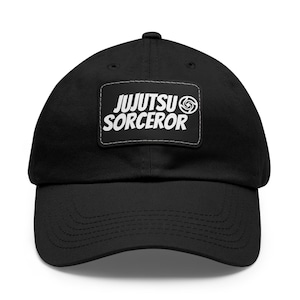 May include: Black cotton baseball cap with a white patch that says "JUJUTSU SORCEROR" and a stylized swirl design.