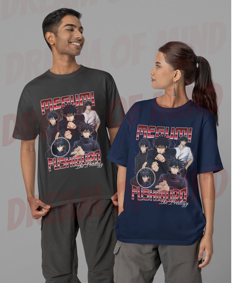 May include: Two t-shirts featuring a graphic of Megumi Fushiguro from the anime Jujutsu Kaisen. The shirts are in dark gray and navy blue with red text that reads "Megumi Fushiguro The Prodigy".