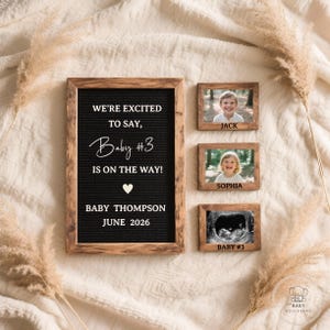 May include: A pregnancy announcement with a black felt letter board in a wooden frame. The board reads "WE'RE EXCITED TO SAY, Baby #3 IS ON THE WAY!" with the name and due date. Three small wooden framed photos are also included.