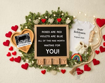 May include: A pregnancy announcement with a letter board that reads "Roses are red, Violets are blue, All of this was worth waiting for YOU!"  The board is surrounded by red hearts, a wooden bead garland, a rainbow, and a baby onesie that reads "Baby Robinson, August 2025".