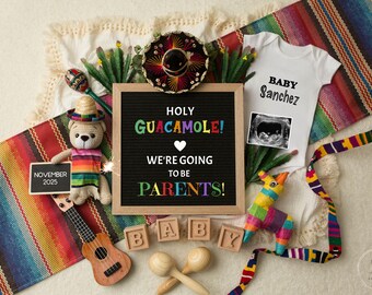 May include: A festive pregnancy announcement with a white onesie, ultrasound image, and a sign that says "Holy Guacamole! We're going to be parents!" A small ukulele, maracas, and a colorful stuffed llama are also included.