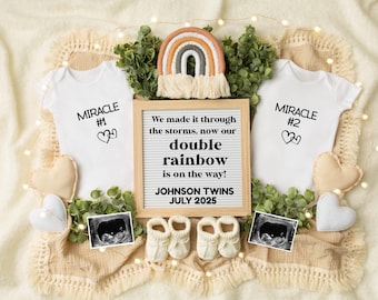 May include: A pregnancy announcement with a rainbow theme. Two white onesies with the text "Miracle #1" and "Miracle #2" are displayed with a letter board that reads "We made it through the storms, now our double rainbow is on the way! Johnson Twins July 2025".
