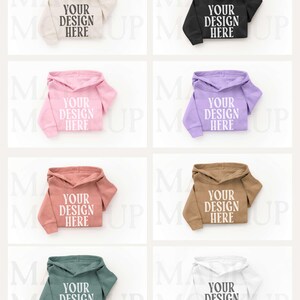 May include: Eight different coloured hoodies are displayed, including beige, black, pink, purple, coral, brown, green, and white. Each hoodie has the text "YOUR DESIGN HERE" printed on the front.