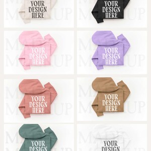 May include: Eight hoodies in different colours: beige, black, pink, purple, coral, brown, green, and white. Each hoodie displays the text "YOUR DESIGN HERE" in a white, bold font.