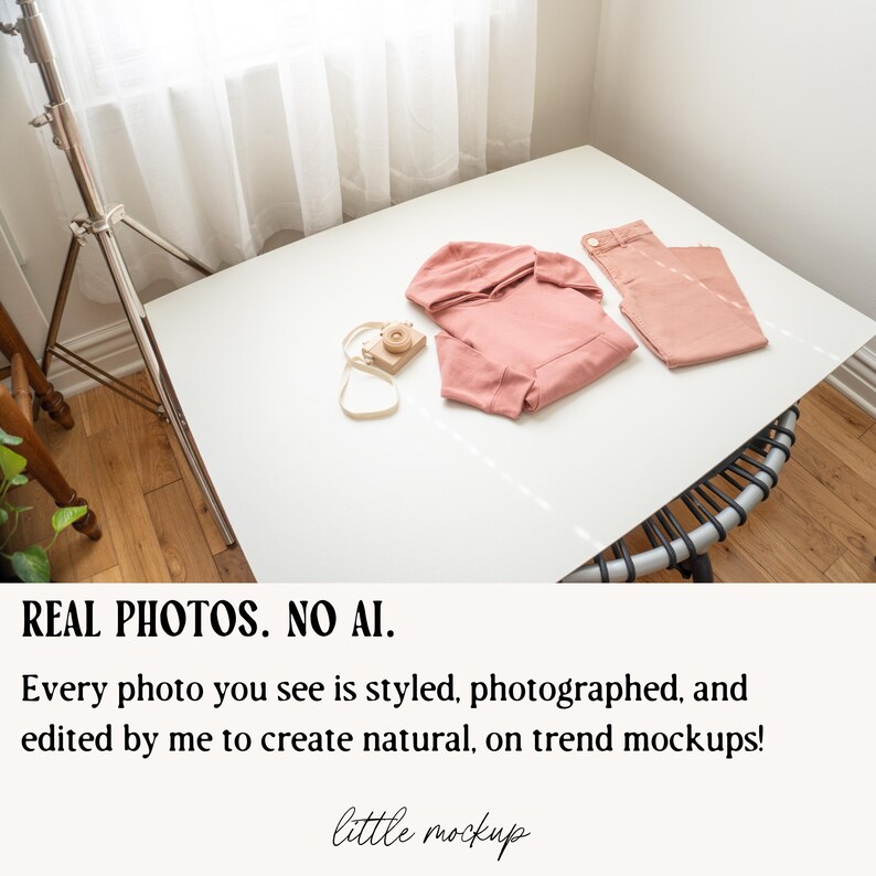 a white table with a pink shirt on top of it