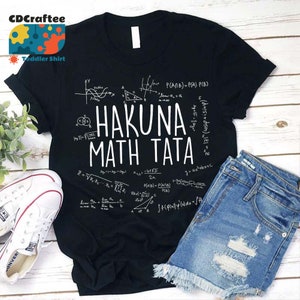 May include: Black t-shirt with white text that reads "Hakuna Math Tata" surrounded by mathematical equations and formulas.