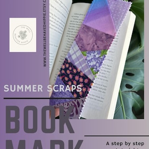 May include: A handmade bookmark made from fabric scraps in shades of purple, blue, and white, inserted into an open book. The bookmark has a ribbon loop and the text "Summer Scraps Book Mark". The Etsy shop name is visible.