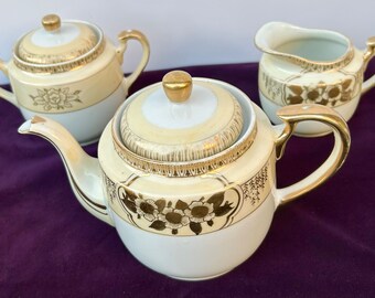 Pre-WWII Made in Japan Three-Piece Hand-Painted Porcelain Tea Set with Gold Gilt Floral Design. Includes Teapot, Sugar Bowl & Creamer!
