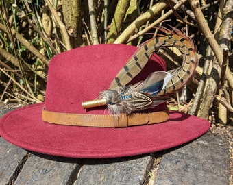 Bow shaped pheasant, mallard and jay fedora hat pin or brooch in a 357 calibre shell.